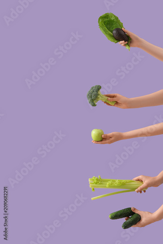 Hands with green vegetables...
