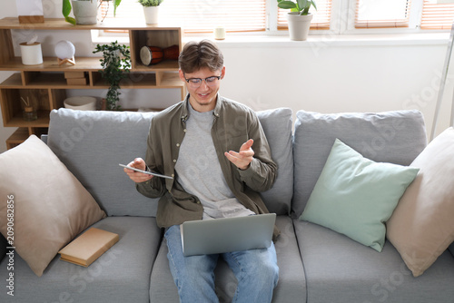 Male student with tablet co...