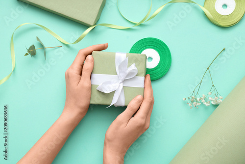 Female hands with gift boxe...