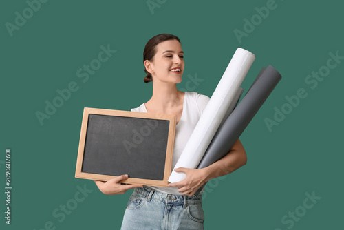 Female teacher with chalkbo...