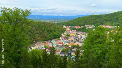 Views of Karlovy Vary from above and see the colorful buildings nestled among trees. This spot highlights the natural beauty and architecture of the area.