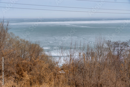 Obraz na plátně Khanka lake shore with frozen coast in Russia China border during the cold day and sandy beach