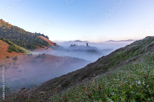 Morning sunrise with fog and mountain scenery