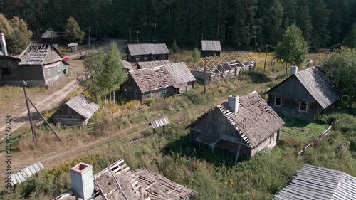 Aerial Drone Flight Over Historic Wooden Village by Lake Surrounded by Forest