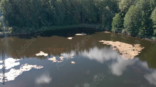 Aerial Drone Flight Over Historic Wooden Village by Lake Surrounded by Forest