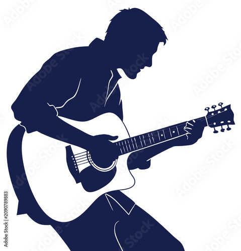 The silhouette of a guitarist playing a guitar.