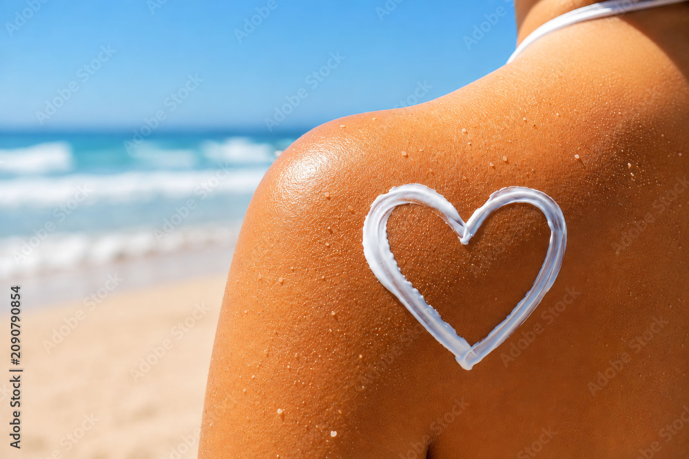 Fototapeta premium Sunscreen Heart on Shoulder as a Beach UV Protection Concept