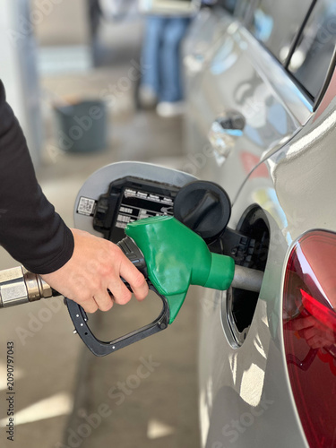 Hand Refueling Car with Green Fuel Nozzle