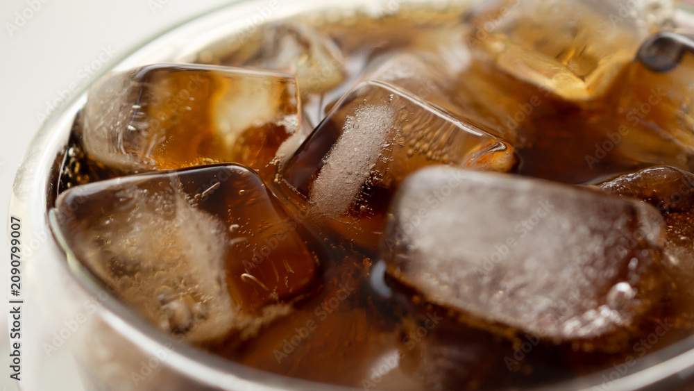 Fototapeta premium Macro Close Up of cola bubbles and ice cubes background