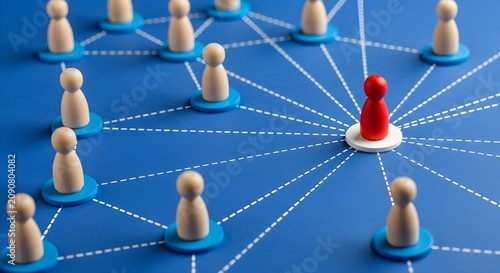 Red leader pawn connecting to wooden group members on blue network map with leadership connection business