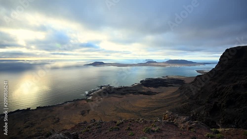 Golden Hour Landscape Vista of Risco de Famara Cliffs, El Rio Strait, and the Chinijo Archipelago in Canary Islands