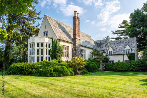Beautiful, large tutor estate home in a picturesque setting with many windows and a slate roof