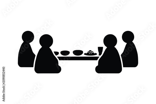 Minimalist black silhouette vector illustration of a family of four people sitting on the floor around a traditional low dining table enjoying a communal meal together in a clean modern style