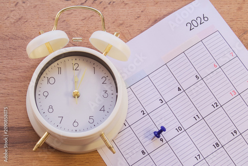 planning, an event or activity is marked in a notebook with a marker.