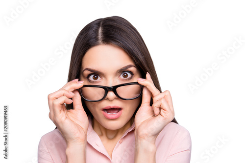 Bild auf Leinwand Portrait of impressed, shocked, angry, stressed woman holding eyelets of glasses