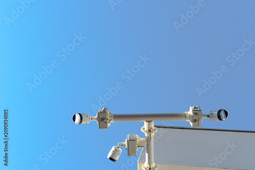 Canvastavla Multiple CCTV security cameras mounted on a building exterior for video surveillance, monitoring and property security