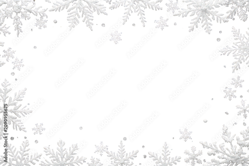 Fototapeta premium White snowflakes forming a classic winter frame for your festive designs. Transparent background for easy layering