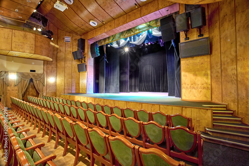 a modern theater stage with a comfortable auditorium for performances