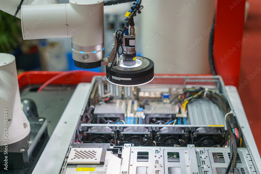Fototapeta premium Machine Vision Camera on Robotic Arm Inspecting Electronics