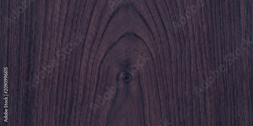 Tablou pe pânză A dark wood grain texture with a prominent knot, showcasing the rich, natural pattern of timber
