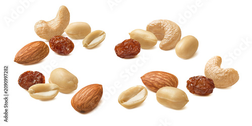 Peanut, cashew and almond nuts, raisin berries isolated on white background. Real photography.
