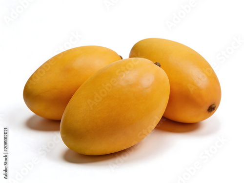 Three ripe mangoes on white background