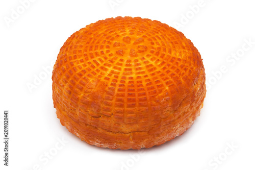 One piece of fresh homemade smoked cheese on a white background. Side view.