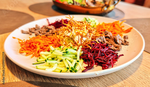 ‘Chafan’ salad, a popular dish in Siberian cuisine, consisting of vegetables and meat.