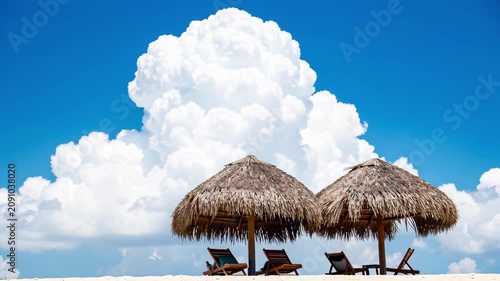 Tropical Beach Resort Under Cloudy Sky.