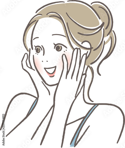 頬に手を当て微笑む女性
