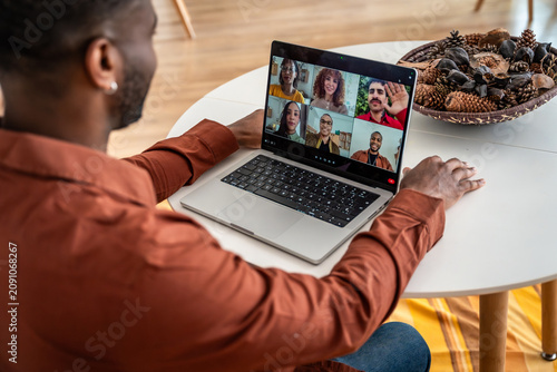 Bild auf Leinwand Man participating in online group therapy session