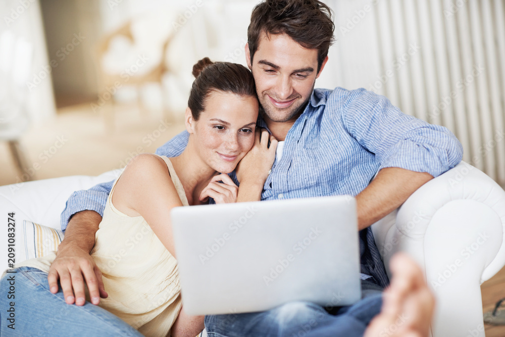 Fototapeta premium Laptop, relax and watching with couple on sofa for streaming service, bonding and movie subscription. Online film, love and multimedia search with man and woman in living room of home for connection