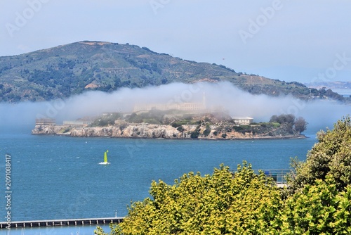 Alcatraz prison island in the ocean mist, as seen from San Francisco.