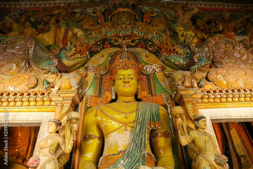 Принти на полотні Interior view of the historic Buddhist image house with vibrant sculptures at Wewurukannala temple