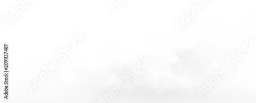 Obraz na plátne Clear background with soft clouds floating in a vast sky, evoking a sense of ope