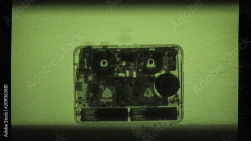 the process of creating an x-ray image of an old cassette player filmed on camera
