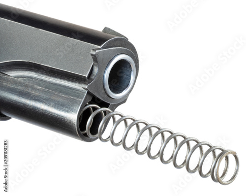 Fotografie 1911 semi-auto pistol recoil spring being released