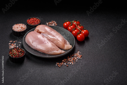 Fresh raw chicken fillet with salt and spices for home cooking. Raw chicken fillet