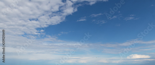 Sky replacement blue skies with white clouds moving in
