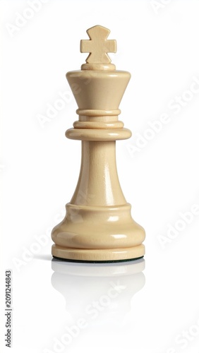 A single, ornate white chess king piece stands centered, with a reflection