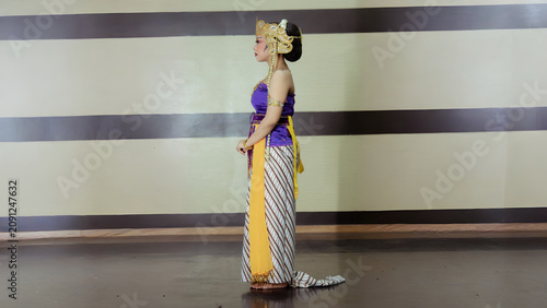 Left Side View of Female Performer in Heritage Dance Costume