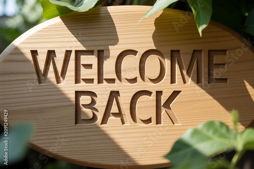 Welcome back wooden sign, engraved garden plaque, leafy decor, outdoor greeting