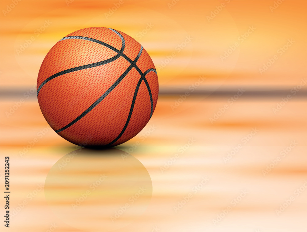 Obraz premium Orange basketball against a wooden background
