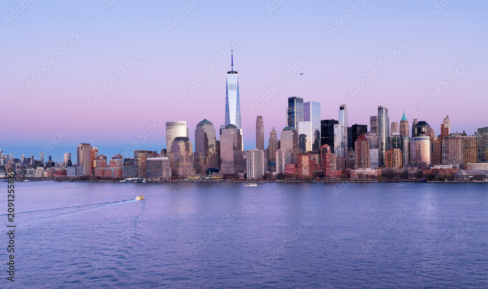 Fototapeta premium NYC night skyline with Manhattan. New York City aerial skyline. New York landscape. NYC metropolis aerial view. New York City skyline with skyscrapers at night. Lower Manhattan skyline.