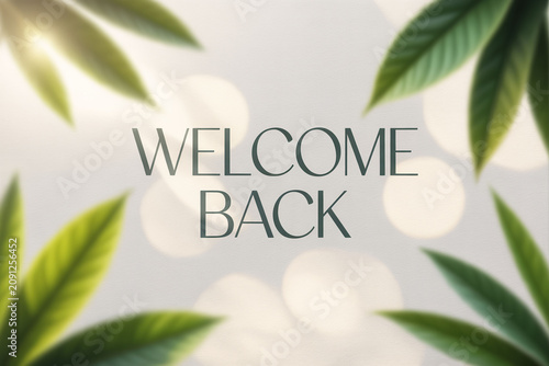 Welcome back text, green leaves, bokeh background, greeting card design, natural style