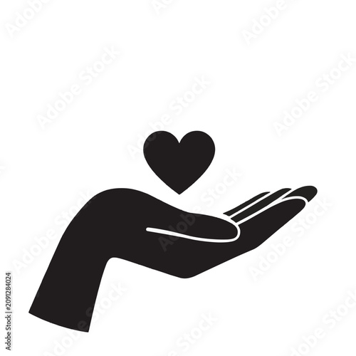 Silhouette of hand holding heart symbol.