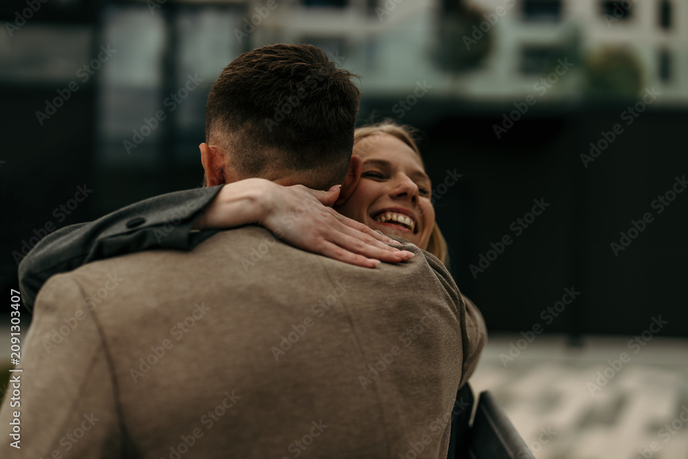 Fototapeta premium Happy couple embracing, showing reunion and togetherness