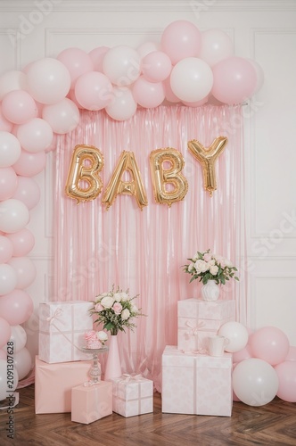 Decorations for a Baby Shower With Balloons and Gifts Arranged in a Festive S...