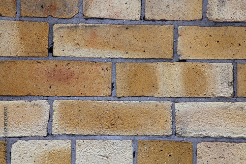 Beige Brick Wall Closeup. Aged, partially grey surface. Photographed in Sweden.