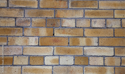 Beige Brick Wall Closeup. Aged, partially grey surface. Photographed in Sweden.